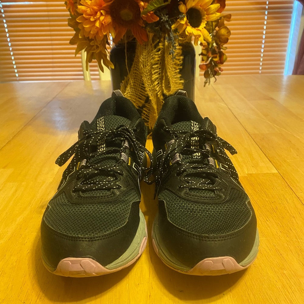 Woman’s ASICS running shoes